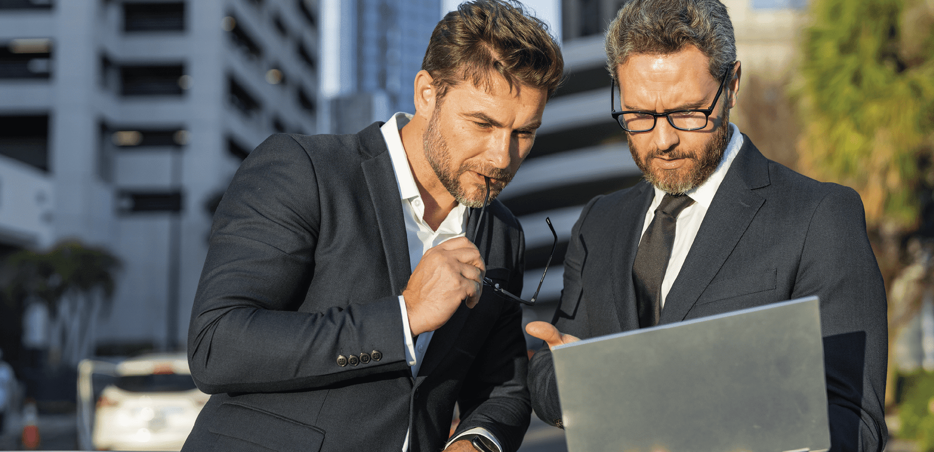 Two men looking through papers