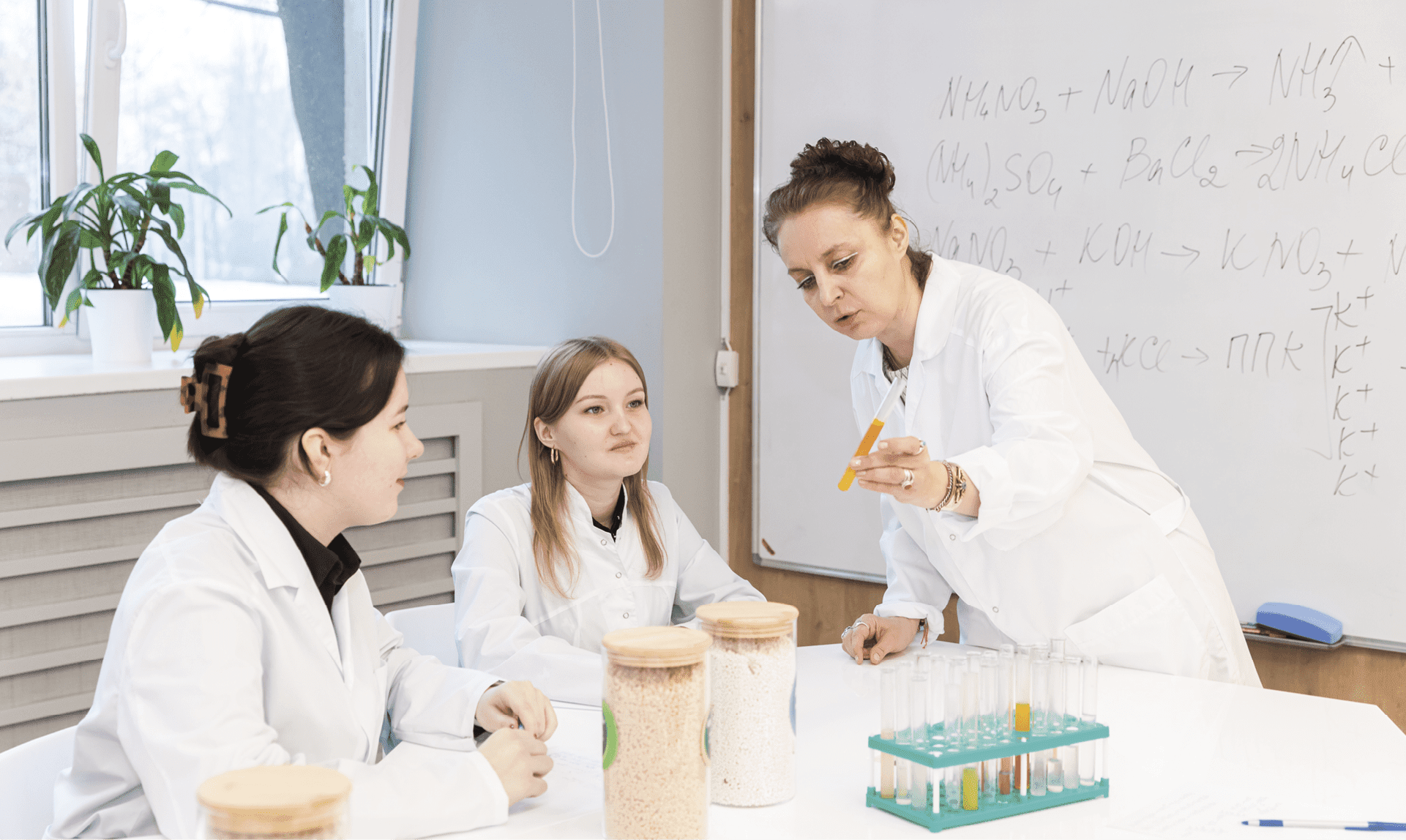 Three scientists discussing products